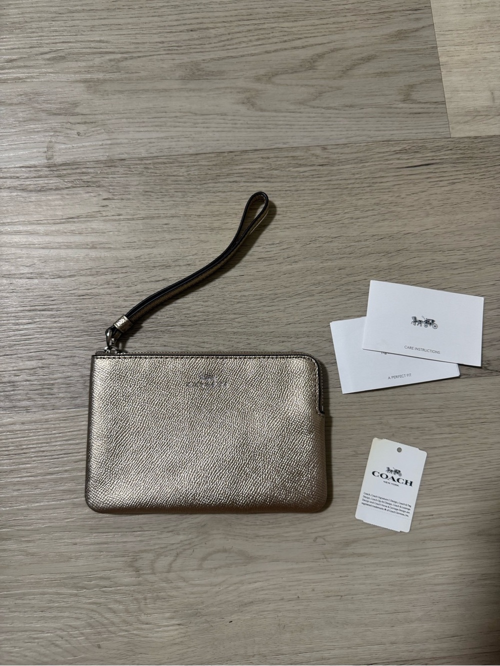 NWT COACH Corner Zip Wristlet Metallic White Gold Coated Canvas
